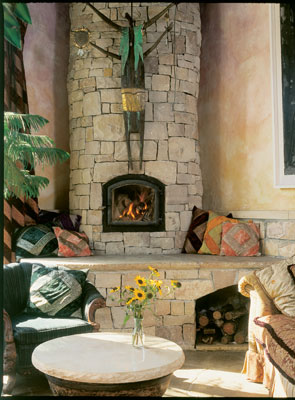 The family spends wintry evenings playing games and talking by the fire in the cozy living room, just off the kitchen hub. "Seeker of Harmony," a shamanic metal sculpture by Santa Fe, New Mexico, artist Bill Worrell, presides over the space.